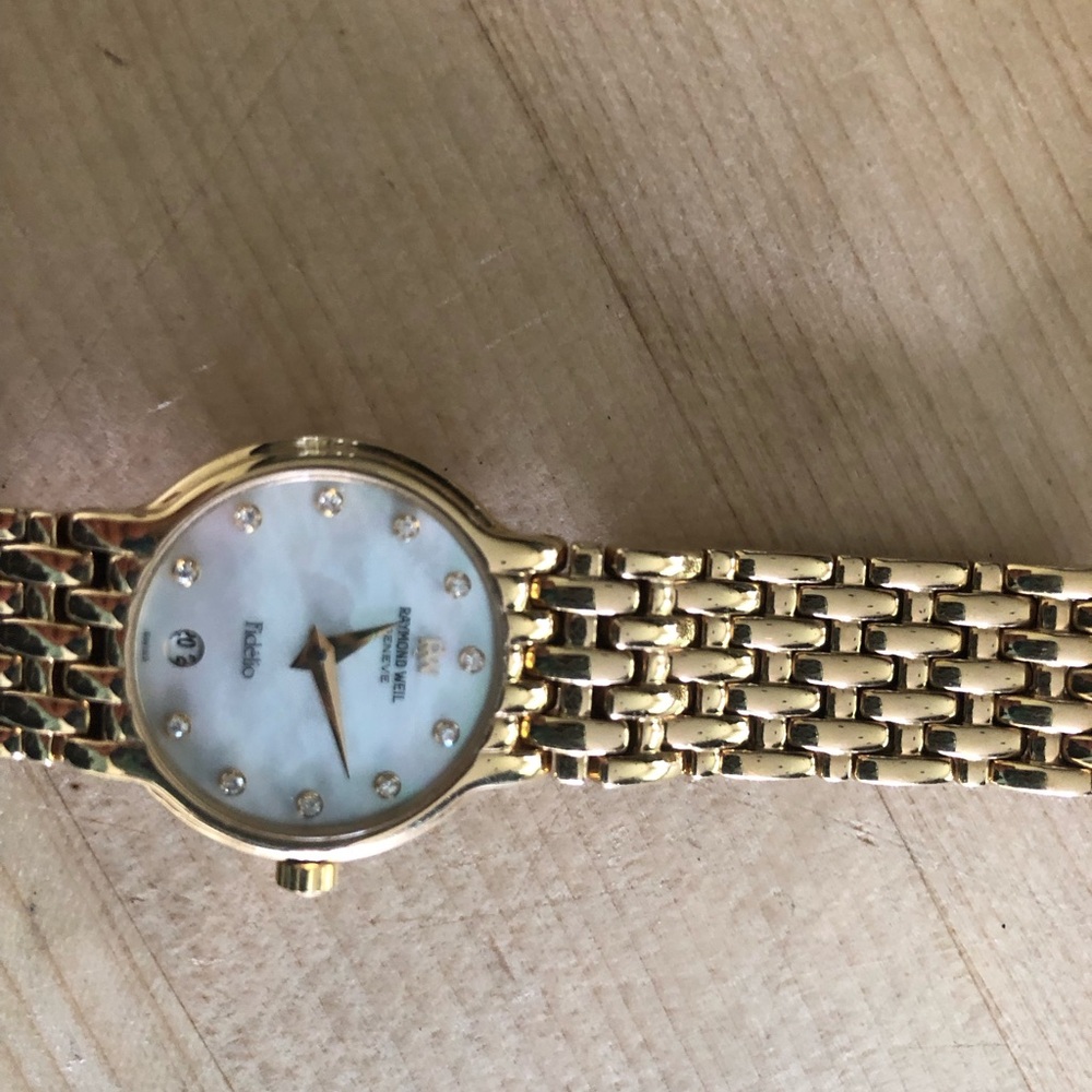 Women’s Raymond Weil gold plated watch w opalescent face diamond numbers